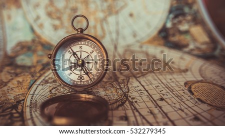 Antique compass and old world map. (vintage style)