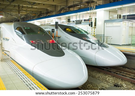FUKUOKA JAPAN - 24 JAN 2015 Bullet train is arriving into HAKATA station. These high speed trains reaching the speeds over 300Km/h. They are called Shinkansen