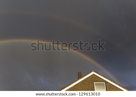 Dark sky with rainbow in Lower Saxony, Germany