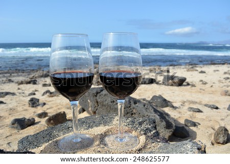 Two glasses of wine in the beach Majanicho in Fuerteventura Canary Island Spain