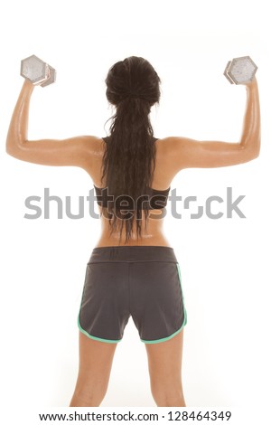 A woman with her weights in her hands showing off her back muscles.