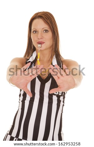 A woman referee is giving a push signal.