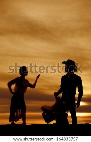 a silhouette of a woman telling her man to come here.