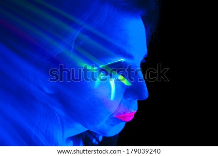 A woman looks like a ghost and is glowing.