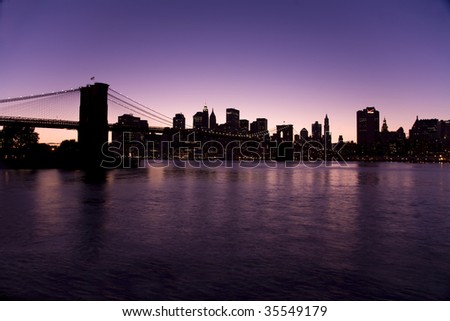 New York skyline at night with the Brooklyn bridge taken from Brooklyn