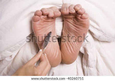 Male feet tickled