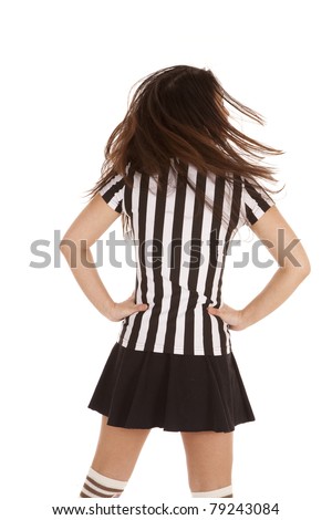 A back view of a referee woman flipping her hair.
