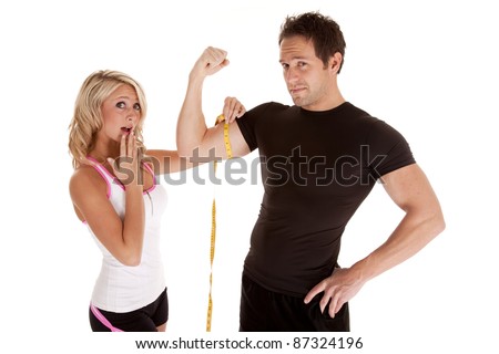 A woman is shocked at how big her man\'s muscles are.