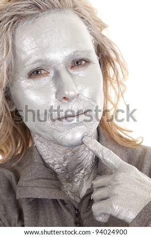 a woman that is painted silver thinking.