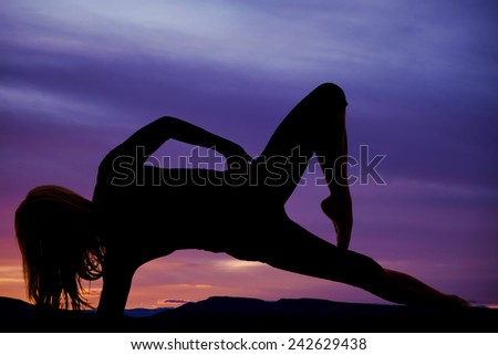 a silhouette of a woman on her side holding her body up, with her knee up.