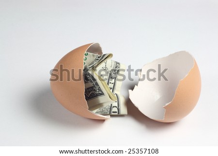 1 dollar in the broken egg.Hatching dollar.