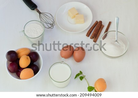 Ingredient for baking: egg, flour, butter, sugar, apricot, plum, milk