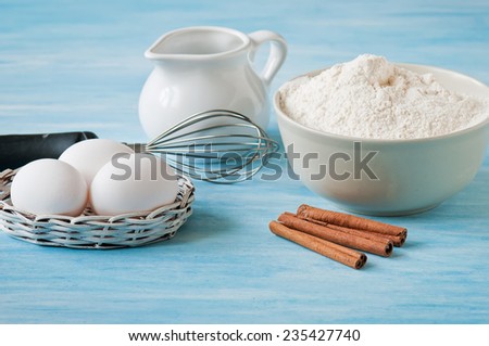 Ingredients and tools to make a cake, meal, eggs and cinnamon
