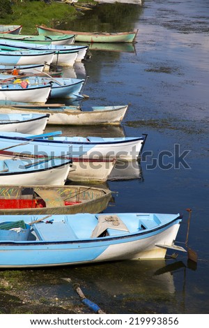 Group of fishing boats aligned with vertical composition