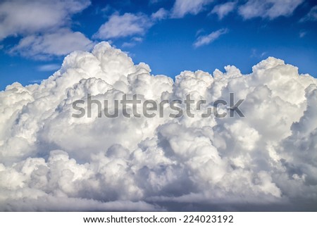 Cloudscape with blue sky and beautiful white cloud texture background