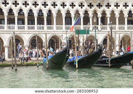 Venice, Italy - April 23, 2015: Sea view of Campanile and Doge\'s palace on Saint Marco square. The Doge\'s Palace is a palace built in Venetian Gothic style, and one of the main landmarks of Venice