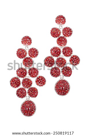red earrings inlaid with precious stones on a white background