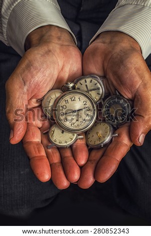 clock in the hands of an old man, a handful of hours