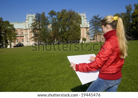 Young blond artist drawing queen palace in autumn