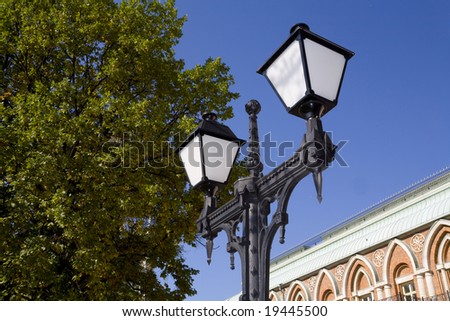 Electric light in queen palace park at sunny day