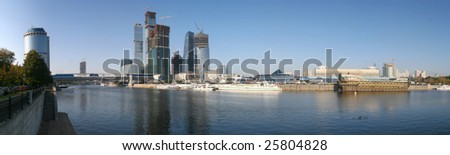 Panorama of business city on Moscow river at sunny autumn day