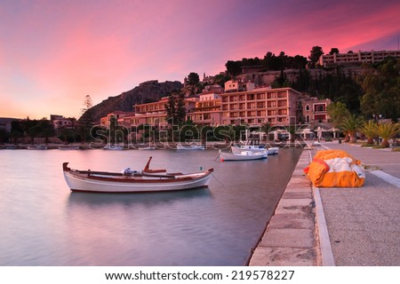 Nafplio seafront with fishing boats and hotels, Greece.