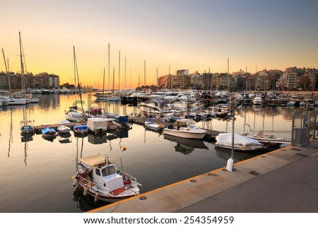 ATHENS, GREECE  JANUARY 15 2015: Fishing boats and yachts in Zea Marina in Athens, Greece on January 15th 2015.