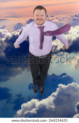 Businessman flying up with cloud sky in background