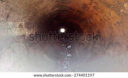 Inside a steel pipe showing corrosion