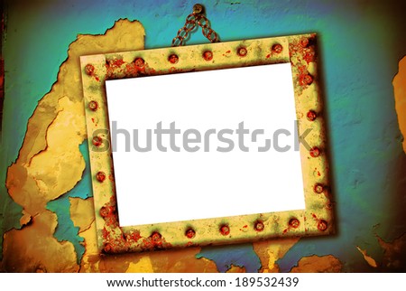 Empty frame hanging on a broken wall, urban style