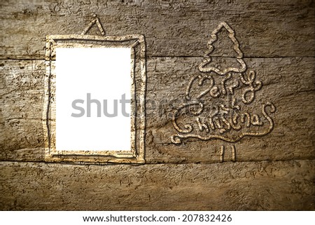 Christmas tree silhouette on old wooden background and frame for text or photo area