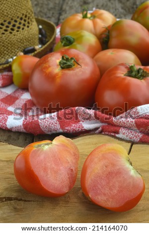 Red tomatoes organic cultivation in old wooden background