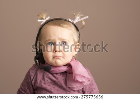 Baby girl getting sad news by phone
