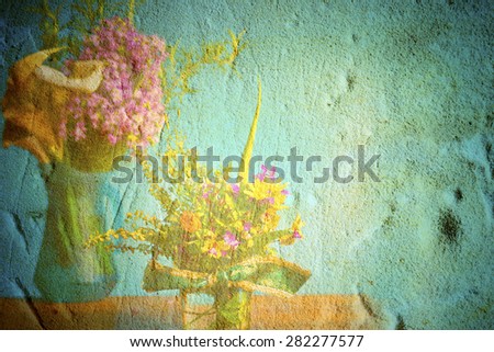 Vases with wild flowers in grunge background with space for text