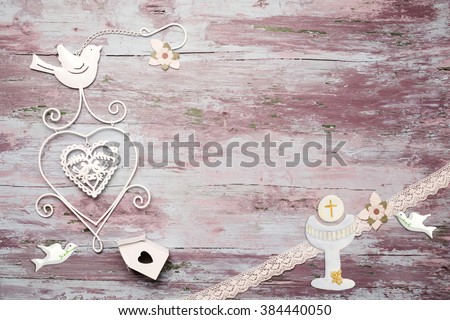 First Communion invitation card, religious symbol on wooden background with copy space to put photo and text