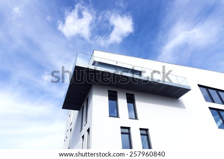 Passive modern building with a balcony on a sunny day