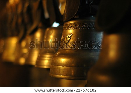 Brass Bells. Line of brass bells, with night-time atmosphere.