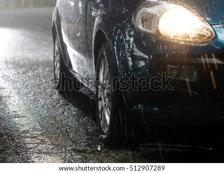 Car stops in the rain