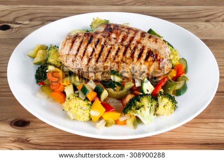 Grilled chicken fillet, breast with cooked vegetable Tomatoes, Carrots, Peppers, Courgettes, brocoli.