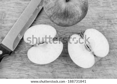 Cut apple in a retro style on a cutting board