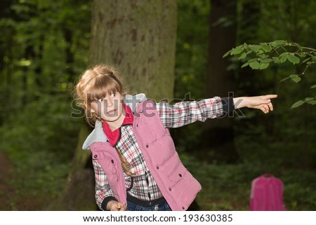 Little girl scared in the woods