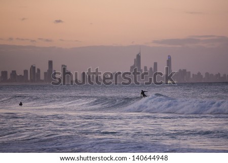 Surfing at dawn on the Gold Coast, Australia