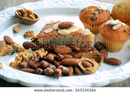 piece of cake with almonds and muffins