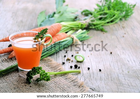 carrot juice on a wooden table, organic food
