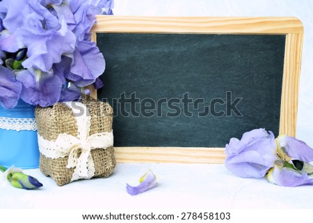 bouquet of flowers and a gift, the background for text or logo