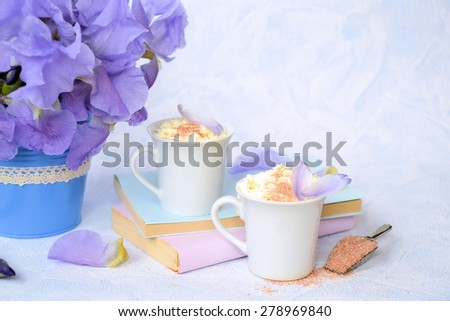 coffee, flowers and books in pastel colors