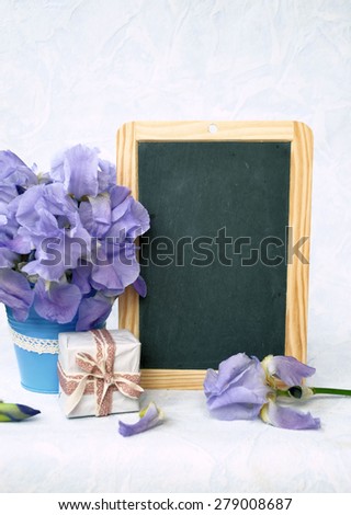 bouquet of flowers and a gift, the background for text or logo