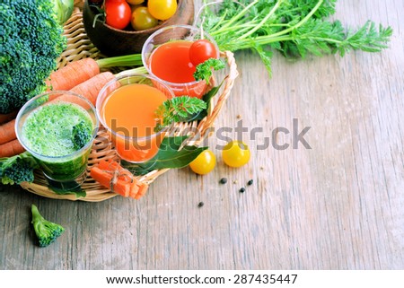 summer smoothies and organic vegetables on a wooden background, background for text or logo, ?oncept veggie food