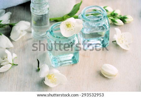 spa concept background with flowers , oils and towels
