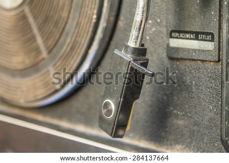 Old dusty vinyl player on isolated background.